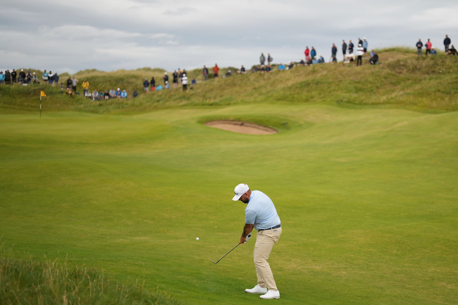 Ryan Peake of Australia plays a shot to the 7th green during the first round of the British Open golf championship at the Royal Portrush Golf Club, Northern Ireland, Thursday, July 17, 2025. (AP Photo/Francisco Seco)