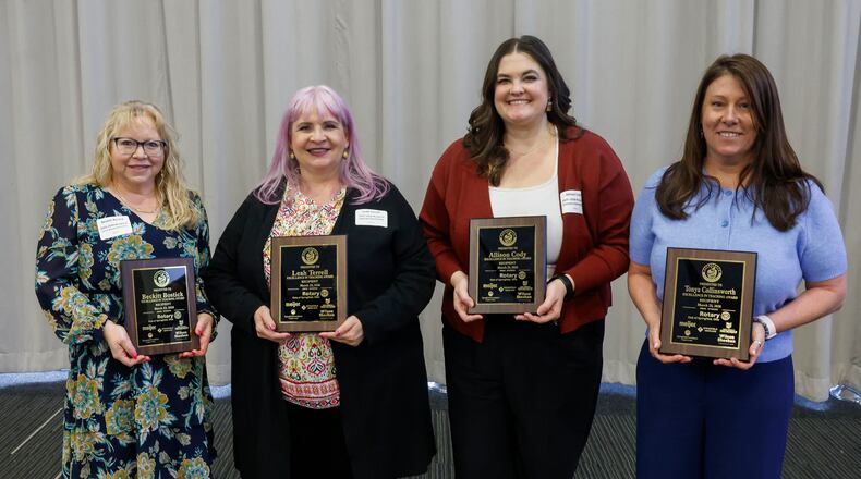 Left to right, Beckitt Bostick, second grade teacher at Perrin Woods Elementary, Leah Terrell, fifth grade ELA and social studies teacher at Lagonda Elementary, Allison Cody, fifth grade math teacher at Greenon Elementary, and Tonya Collinsworth, eighth grade science teacher at Shawnee Middle School hold the Excellence in Teaching awards they received at a luncheon at the Hollenbeck Bayley Center on Monday, March 23, 2026, in Springfield. JOSEPH COOKE/STAFF