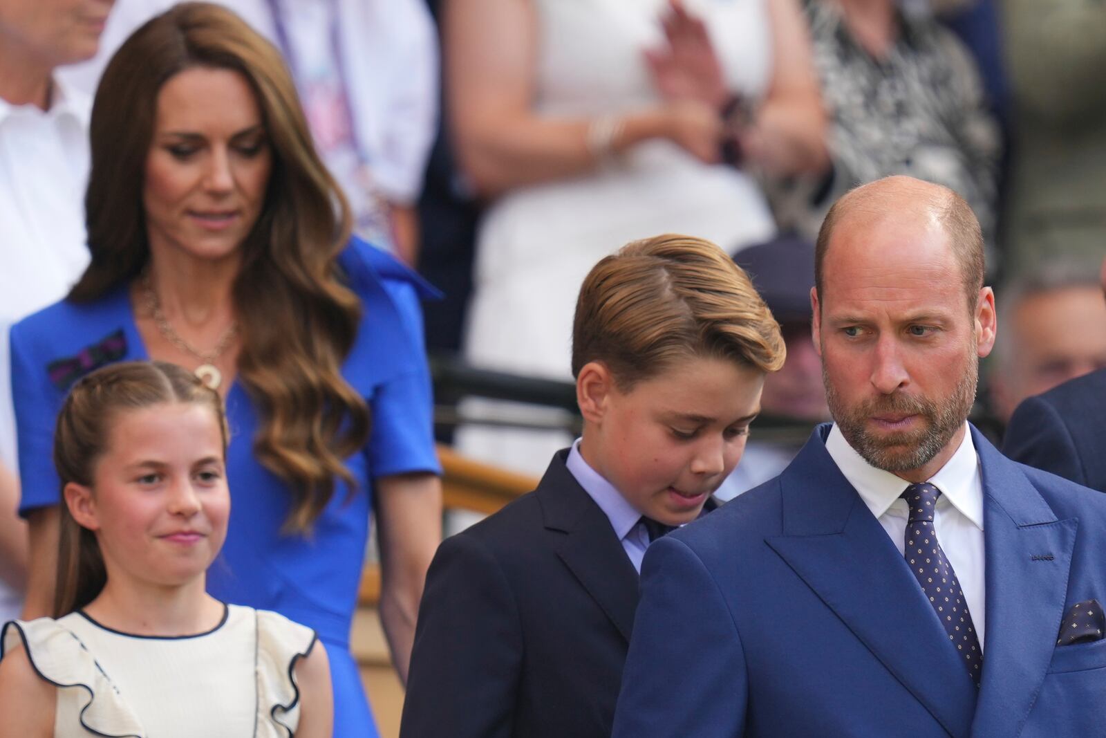 Britain's Prince William, right, Kate, Princess of Wales, rear,Prince George and Princess Charlotte arrive to watch Jannik Sinner of Italy and Carlos Alcaraz of Spain during their men's singles final match at the Wimbledon Tennis Championships in London, Sunday, July 13, 2025.(AP Photo/Kirsty Wigglesworth)
