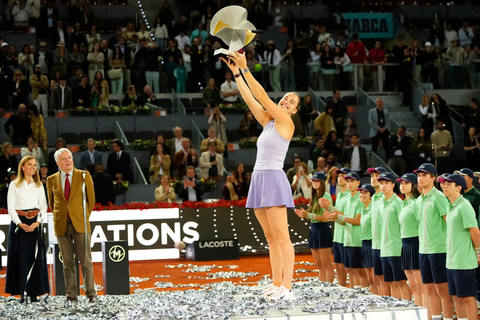 Aryna Sabalenka of Belarus holds a trophy after winning the Madrid Open tennis final in Madrid, Spain, Saturday, May 3, 2025. (AP Photo/Jose Breton)