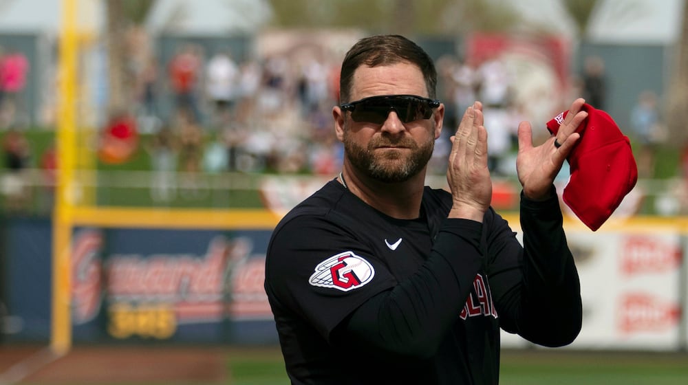 FILE - Cleveland Guardians manager Stephen Vogt turns to acknowledge veterans before the start of a spring training baseball game against the Cincinnati Reds, Feb. 24, 2024, in Goodyear, Ariz. (AP Photo/Carolyn Kaster, File)