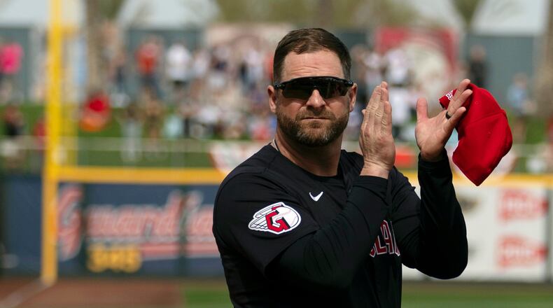 FILE - Cleveland Guardians manager Stephen Vogt turns to acknowledge veterans before the start of a spring training baseball game against the Cincinnati Reds, Feb. 24, 2024, in Goodyear, Ariz. (AP Photo/Carolyn Kaster, File)