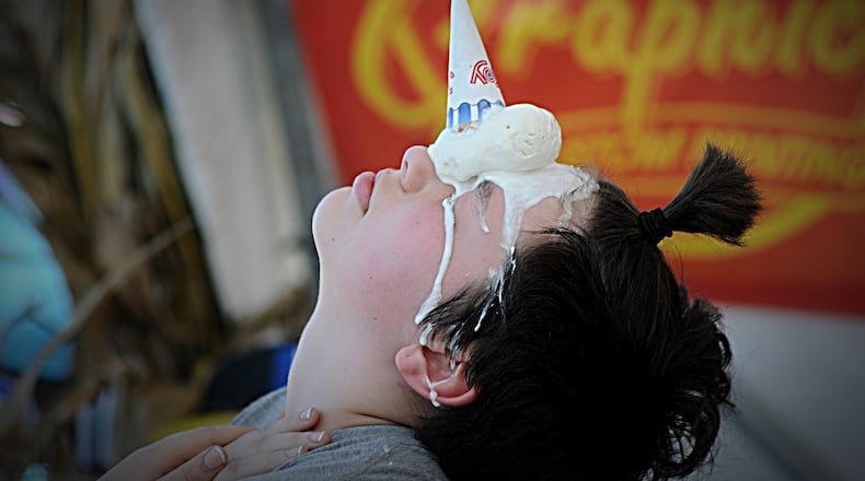 A child participates in the unicorn challenge at the New Carlisle Heritage of Flight Festival. The challenge was sponsored by Arrow Queen, which is celebrating its 50th season in business on Sunday. MARSHALL GORBY/STAFF