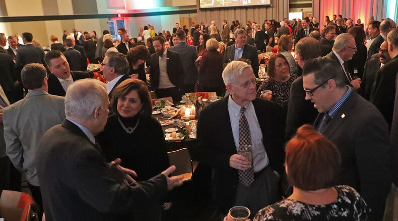 Members of The Chamber of Greater Springfield mingle in the main hall of the Hollenbeck Bayley Conference Center during their annual meeting in 2019. BILL LACKEY/STAFF