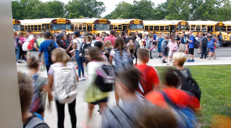Just two weeks ago, Dayton-area schools were packed with kids, but now they sit silent. FILE PHOTO