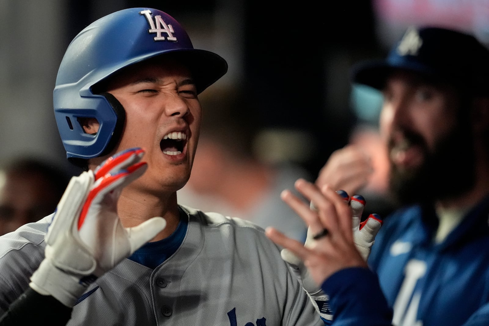 Los Angeles Dodgers two-way player Shohei Ohtani (17) celebrates his solo homer against the Atlanta Braves in the third inning of a baseball game, Saturday, May 3, 2025, in Atlanta. (AP Photo/Mike Stewart)