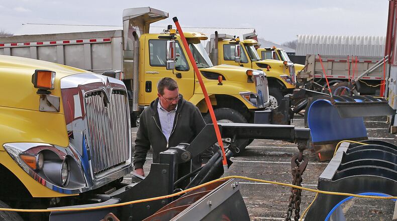 Clark County Engineer Jonathan Burr looks over the county’s salt trucks in 2020. Bill Lackey/Staff