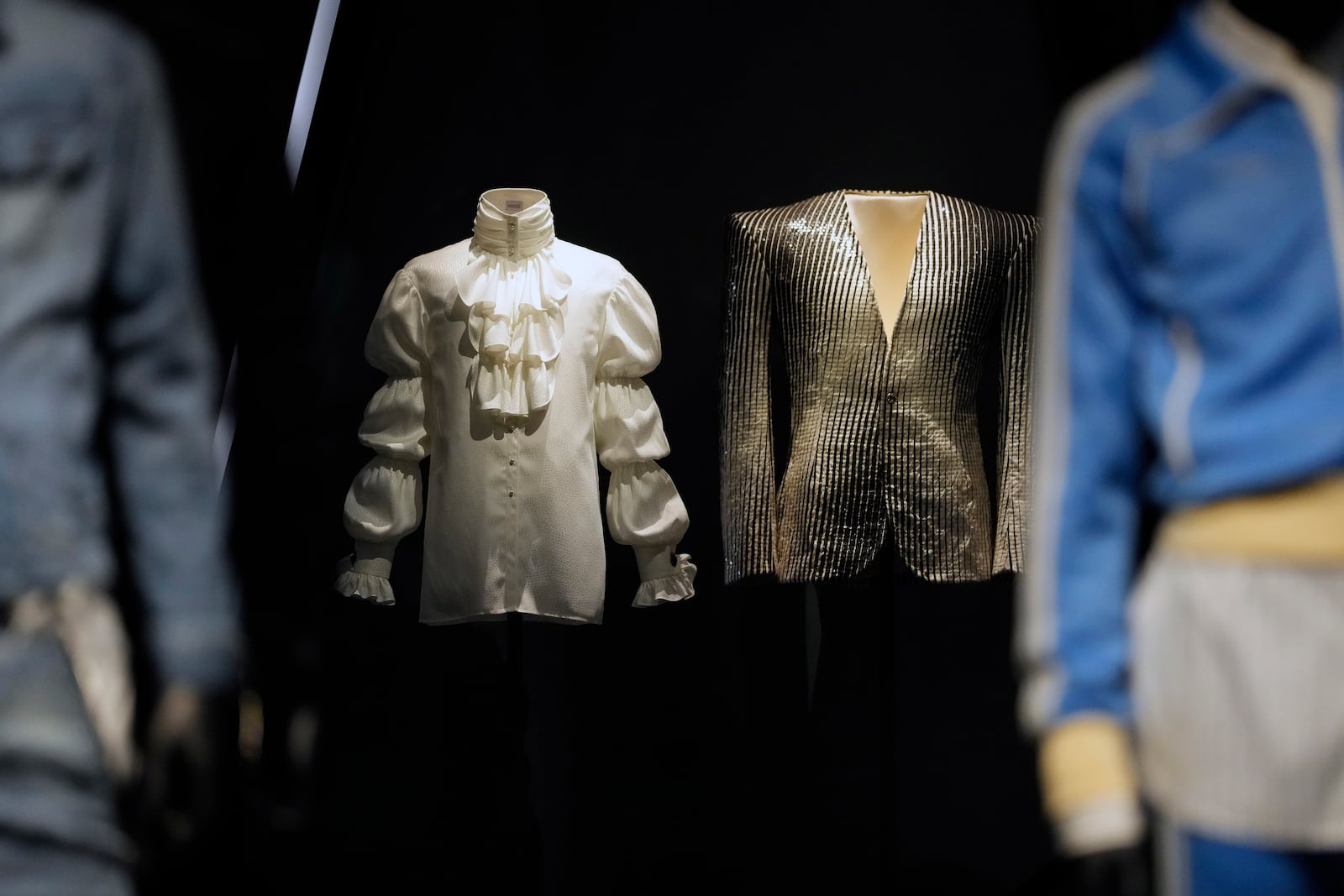 Designs by Louis Wells and worn by Prince, second from left, and Pat Campano and worn by Sylvester, second from right, are displayed at the Metropolitan Museum of Art's Costume Institute exhibition, "Superfine: Tailoring Black Style," on Saturday, May 3, 2025, in New York. (Photo by Charles Sykes/Invision/AP)