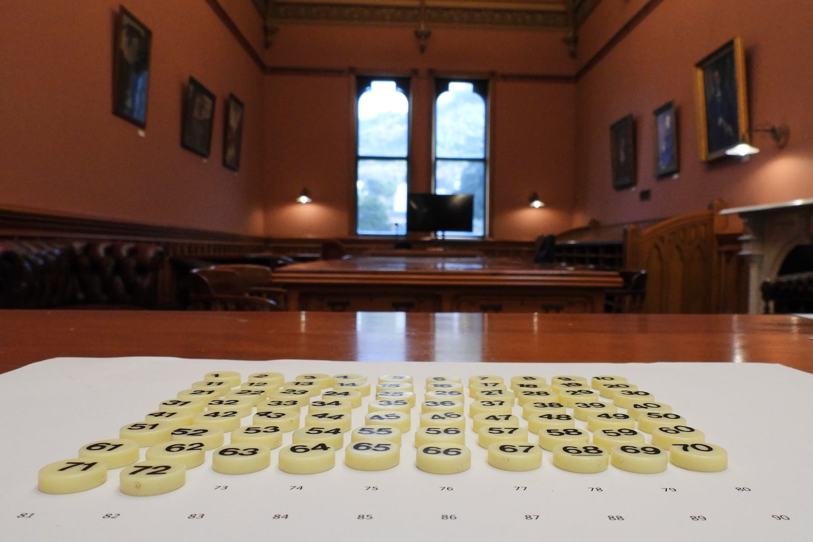 Bingo tokens, each representing a lawmaker's bill to be entered into the ballot, are laid out before the draw at Parliament in Wellington, New Zealand, Thursday, May 22, 2025. (AP Photo/Charlotte Graham-McLay)