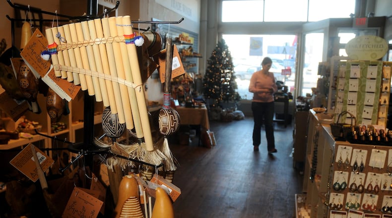 Melissa Townsend walks through the newly opened Fair Trade Winds store on North Fountain Ave. Staff file photo