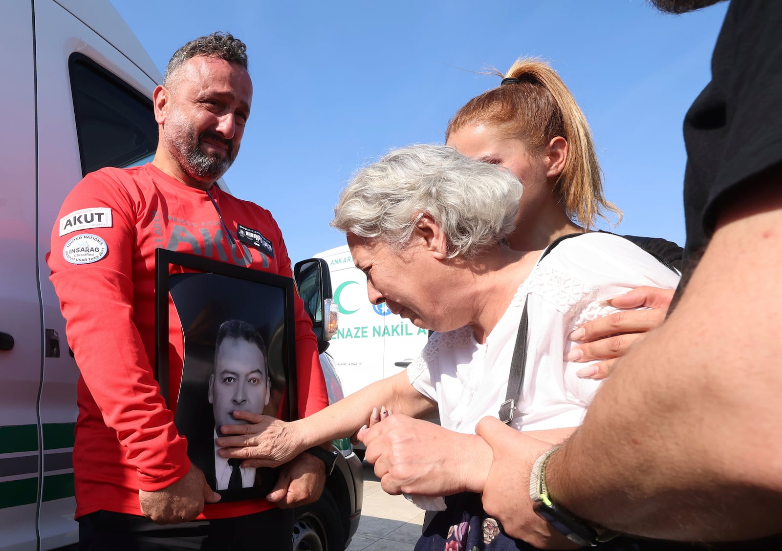 Relatives and friends mourn during the funeral of five rescue volunteers killed while battling a wildfire in northwestern Eskisehir province, in Ankara, Turkey, Thursday, July 24, 2025. (Yavuz Ozden/Dia Photo via AP)