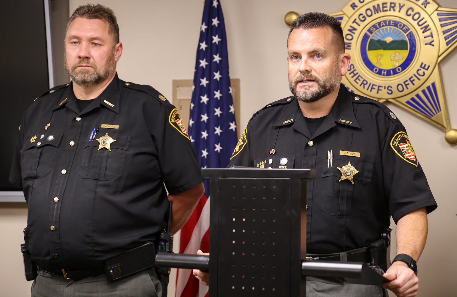 Montgomery County Sheriff's Office Chief of Staff Jeremy Roy speaks while Major Andy Flagg listens during a news conference on Tuesday, Oct. 7 in downtown Dayton. Roy released details about a crash that killed three people, though names are still not being released. The crash occurred early Sunday in Huber Heights. BRYANT BILLING / STAFF