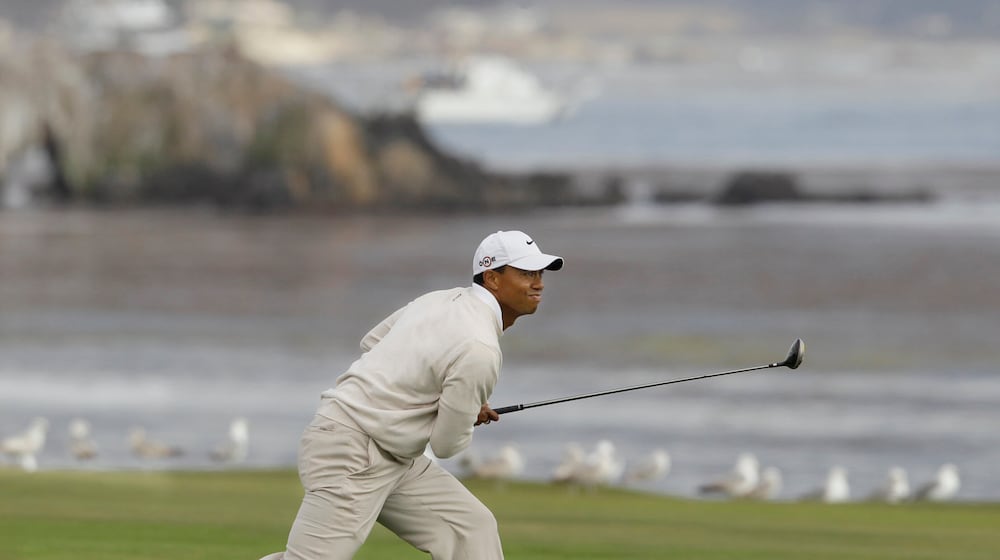 FILE - Tiger Woods watches his approach shot to the 18th green during the third round of the U.S. Open golf tournament Saturday, June 19, 2010, at the Pebble Beach Golf Links, in Pebble Beach, Calif. (AP Photo/Eric Risberg, File)