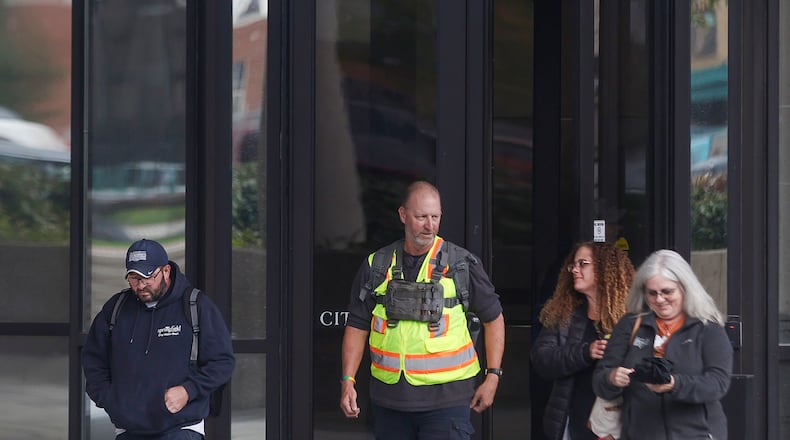 Employees leave work on Thursday, October 30, 2025, at Springfield City Hall. JOSEPH COOKE/STAFF