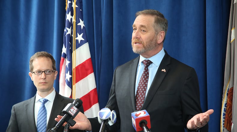 U.S. Attorney Benjamin C. Glassman (left) and Ohio Attorney General Dave Yost in an April 2019 file photo. LISA POWELL / STAFF