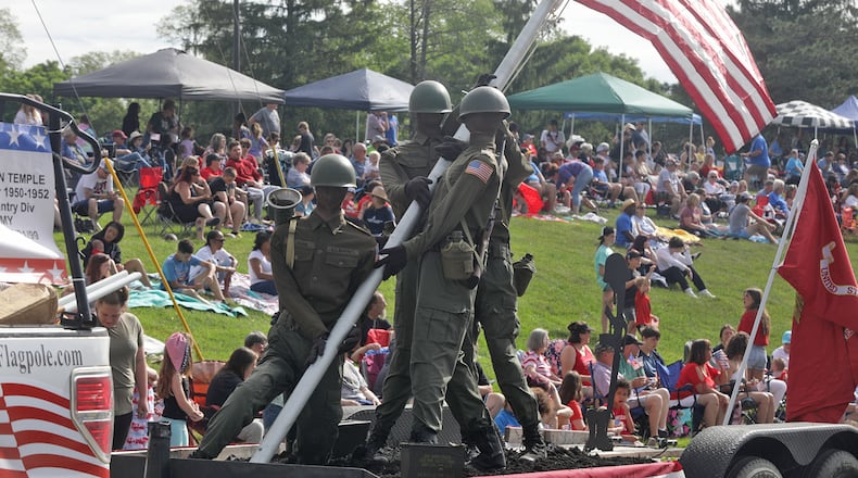The Springfield Memorial Day Parade will be held at 9 a.m. on Monday, May 27. Last year, thousands of people lined the parade route in their red, white and blue regalia to watch the 2023 Springfield Memorial Day Monday, May 29, 2023. The parade, which featured floats, fire trucks and bands, began with the throwing of the ceremonial wreath into Buck Creek and the somber sound of TAPS playing to honor those who haven given their lives in service to our country. FILE/BILL LACKEY/STAFF