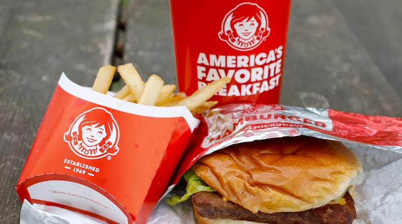 FILE - In this May 5, 2020, file  photo, Wendy's restaurant Dave's Combo cheeseburger meal is displayed in Pittsburgh. Wendy’s plans to open 700 delivery-only kitchens by 2025 to meet the growing demand from people who want their fast food brought to them. The kitchens will primarily operate in urban neighborhoods in the U.S., Canada and the United Kingdom, the company said. (AP Photo/Gene J. Puskar, File)