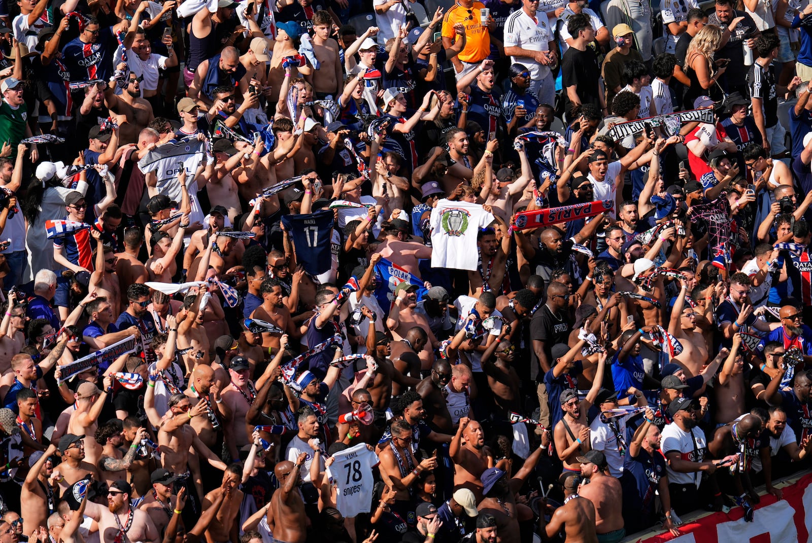Paris Saint-Germain fans cheer after Goncalo Ramos scored during the Club World Cup semifinal soccer match between PSG and Real Madrid in East Rutherford, N.J., Wednesday, July 9, 2025. (AP Photo/Pamela Smith)
