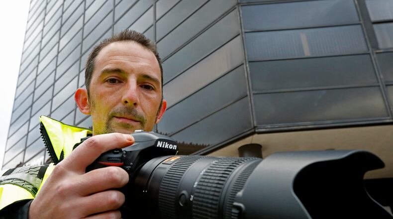 New Carlisle Photographer Andy Grimm has sued the Clark County deputy that shot him, Clark County and the city of New Carlisle. Bill Lackey/Staff