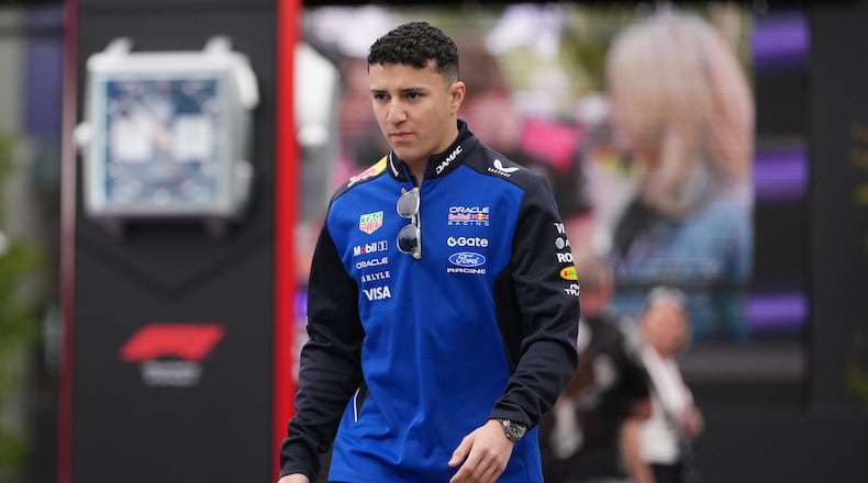 Red Bull driver Isack Hadjar of France arrives at the track ahead of the first practice session for the Australian Formula One Grand Prix at Albert Park, in Melbourne, Australia, Friday, March 6, 2026. (AP Photo/Asanka Brendon Ratnayake)