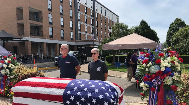 Keith and Lisa Garvin stand before a coffin to draw awareness to the issue of veteran suicide as part of the Silent Watch event in downtown Springfield on Saturday. Volunteers stood for 15 minutes at a time from 7 a.m. to 5:30 p.m. at the event, presented by the Clark County Veterans Service Commission and sponsored by Jackson, Lytle & Lewis Life Celebration Center.