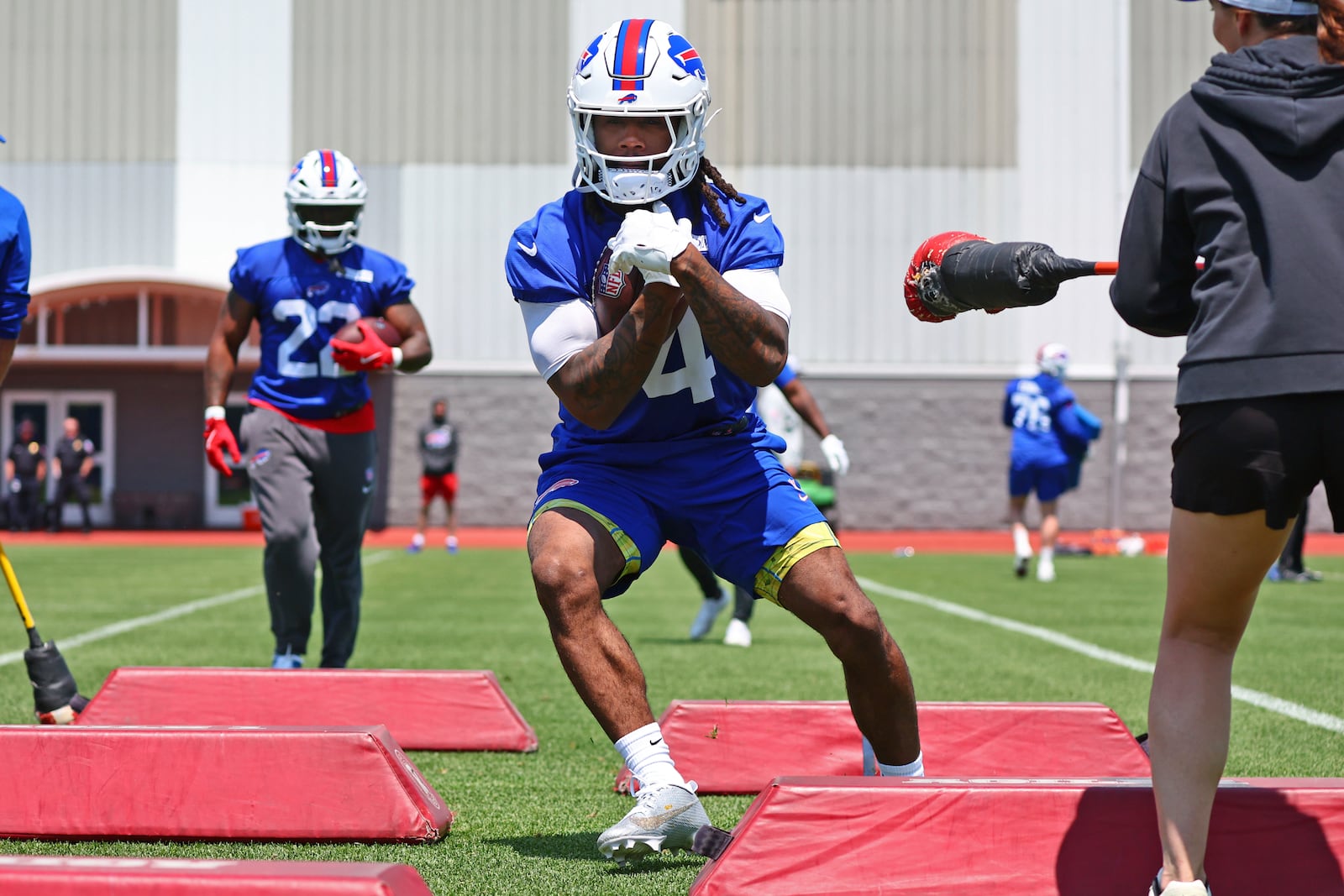 Buffalo Bills running back James Cook (4) runs a drill during practice at NFL football minicamp in Orchard Park, N.Y., Tuesday June 10, 2025. (AP Photo/Jeffrey T. Barnes)