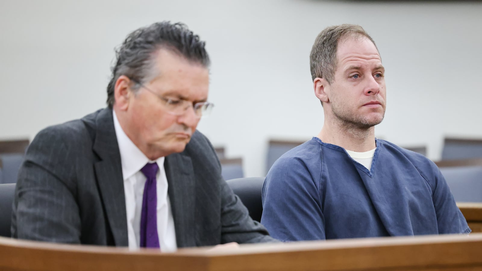 Caleb Flynn (right) listens during an arraignment on Thursday, March 19 at Miami County Common Pleas Court in Troy. Flynn's bond was increased to $3.5 million from the $2 million bond set in Miami County Municipal Court. He was arraigned Thursday following his indictment by a county grand jury Wednesday on 11 counts, including aggravated murder in the Feb. 16 death of his wife, Ashley. BRYANT BILLING / STAFF