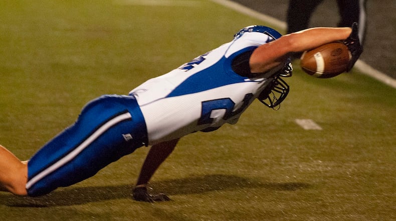 Brookville running back Sammy Daffler breaks through tackles to on a 15-yard run to reach the one. He scored on the next play for an early 6-0 lead Friday night at Franklin. Jeff Gilbert/CONTRIBUTED