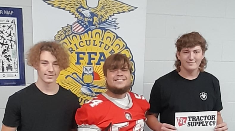Southeastern Local School District’s FFA Chapter received a grant to help support developments or improvements of agriculture education projects. Students pictured are (L-R): Chad Spencer, Peyton Hamilton (Southeastern FFA President) and Kody Keehner. Contributed