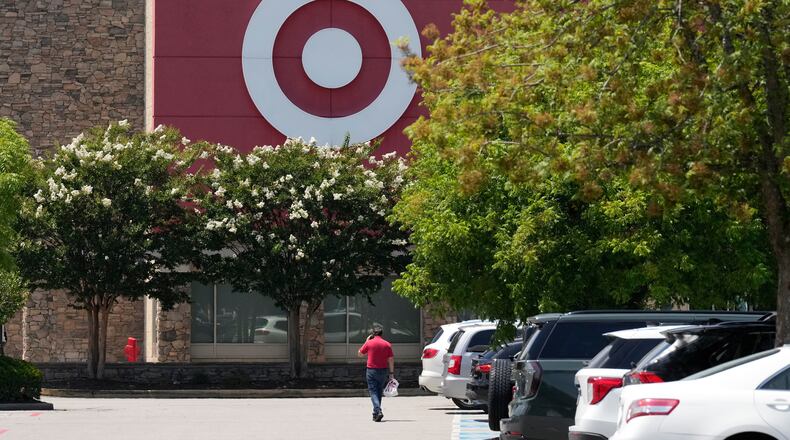 FILE - A person walks towards a Target store, July 15, 2025, in Nashville, Tenn. (AP Photo/George Walker IV, File)