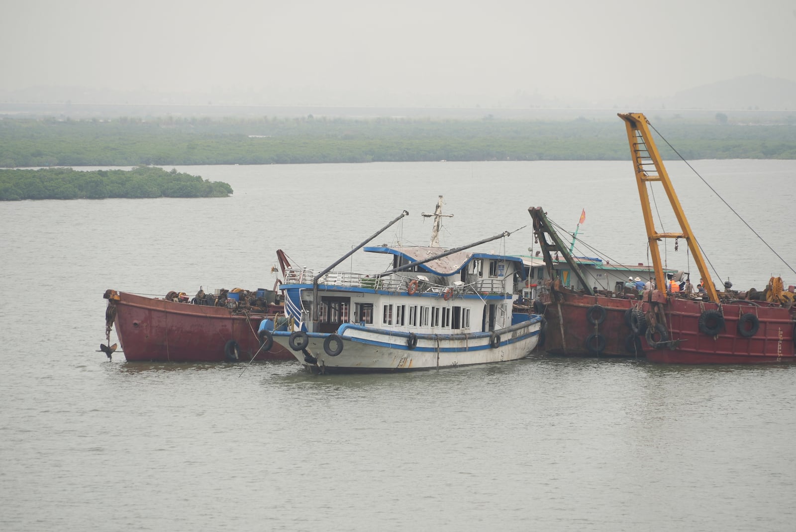 Tourist boat Wonder Sea is towed to a shipyard for investigation after its capsizing, which killed multiple people, in a thunderstorm in Ha Long Bay, Vietnam Sunday, July 20, 2025. (AP Photo/Huy Han)