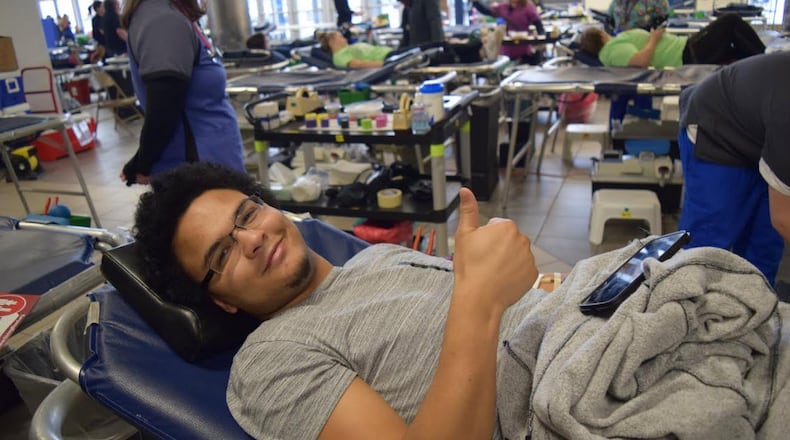 Fairmont student Gabe Davis gives a ‘thumbs up’ as he donates blood during the high school’s March Blood Drive. CONTRIBUTED