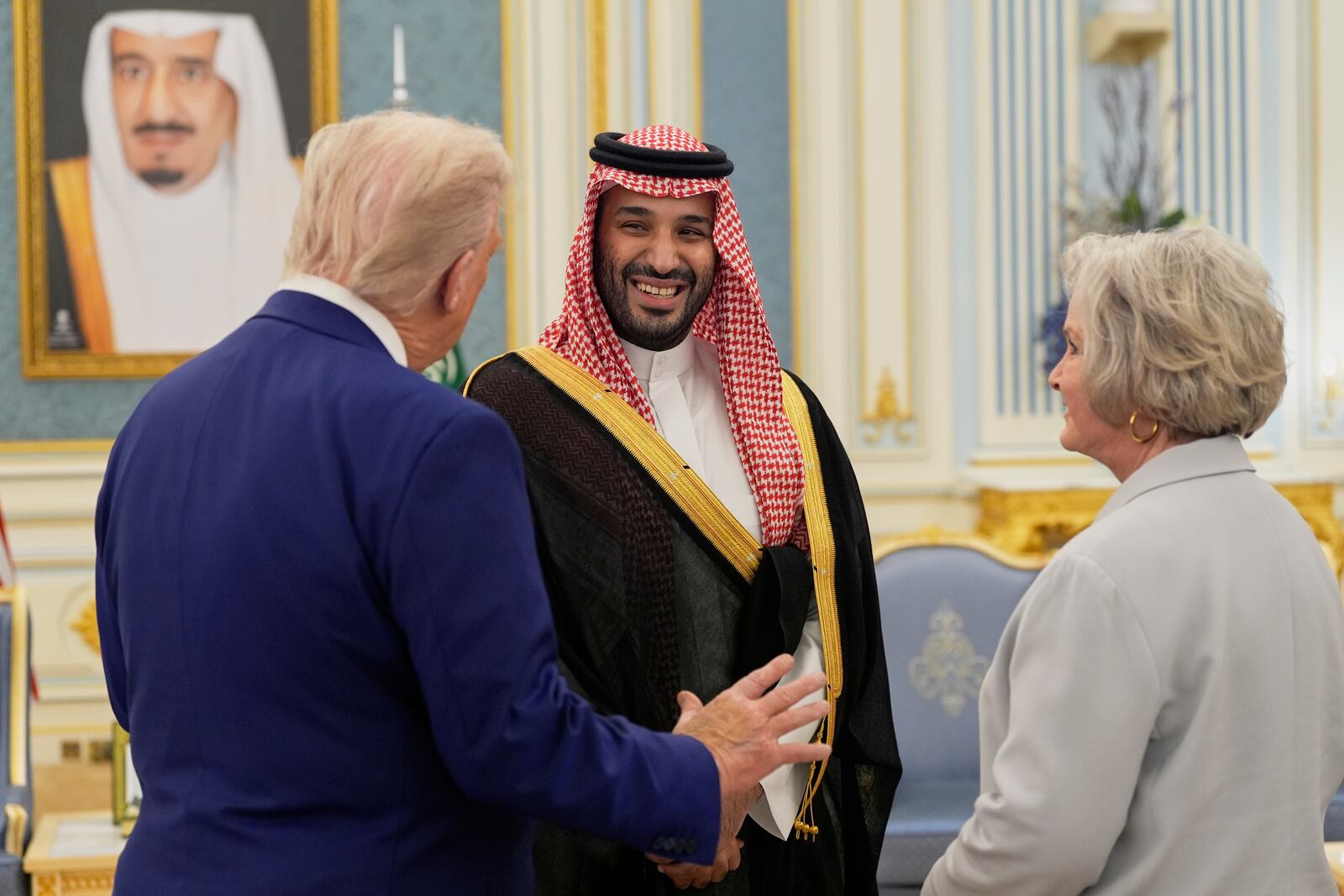 President Donald Trump, left, Saudi Crown Prince Mohammed bin Salman, center, and White House Chief of Staff Susie Wiles speak at the Royal Palace in Riyadh, Saudi Arabia, Tuesday, May 13, 2025. (AP Photo/Alex Brandon)