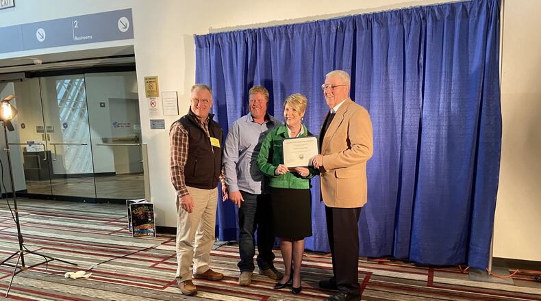 Clark County resident Ed Kranz was recognized at the 94th Ohio Fair Managers Association annual convention for his outstanding service to the fair. From left to right: Dean Blair, Executive Director of the Clark County Fairgrounds; Brian Harbage, President of the Clark County Agricultural Society; Dorothy Pelanda, Director of the Ohio Department of Agriculture; and Ed Kranz. CONTRIBUTED