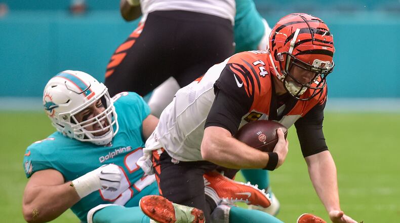 MIAMI, FLORIDA - DECEMBER 22: Zach Sieler #92 of the Miami Dolphins sacks Andy Dalton #14 of the Cincinnati Bengals in the first quarter of the game at Hard Rock Stadium on December 22, 2019 in Miami, Florida. (Photo by Eric Espada/Getty Images)