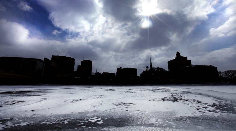 A frozen river and frigid sky frames downtown Dayton Feb. 19, 2015 . LISA POWELL / STAFF