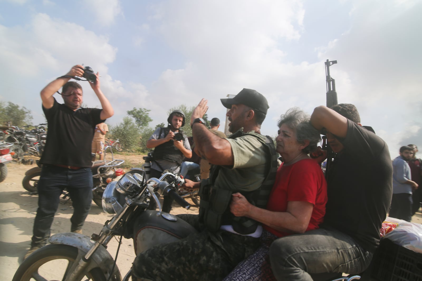 FILE -Hamas militants transport Adina Moshe, 72, inside the Gaza Strip after kidnapping her from her home in Nir Oz, a kibbutz in Israel near the Gaza border, on Oct. 7, 2023. (AP Photo), File)