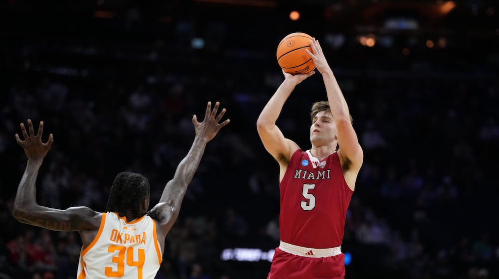 Miami (Ohio)'s Peter Suder, right, goes up for a shot against Tennessee's Felix Okpara during the second half in the first round of the NCAA college basketball tournament, Friday, March 20, 2026, in Philadelphia. (AP Photo/Matt Slocum)