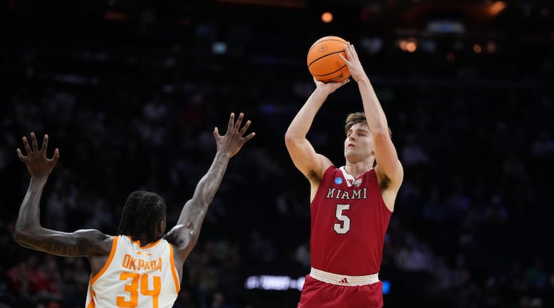 Miami (Ohio)'s Peter Suder, right, goes up for a shot against Tennessee's Felix Okpara during the second half in the first round of the NCAA college basketball tournament, Friday, March 20, 2026, in Philadelphia. (AP Photo/Matt Slocum)