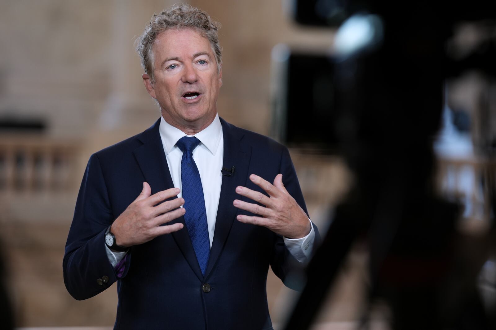 As Senate Republicans work to advance President Donald Trump's spending and tax bill, Sen. Rand Paul, R-Ky., who is opposed to the reconciliation package because of the debt-limit increase, does a TV news interview at the Capitol in Washington, Tuesday, June 3, 2025. (AP Photo/J. Scott Applewhite)