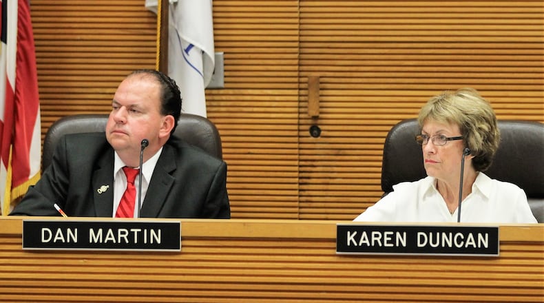 City Commissioners Dan Martin and Karen Duncan listen to city staff discuss the medical marijuana moratorium earlier this year. MICHAEL COOPER/STAFF