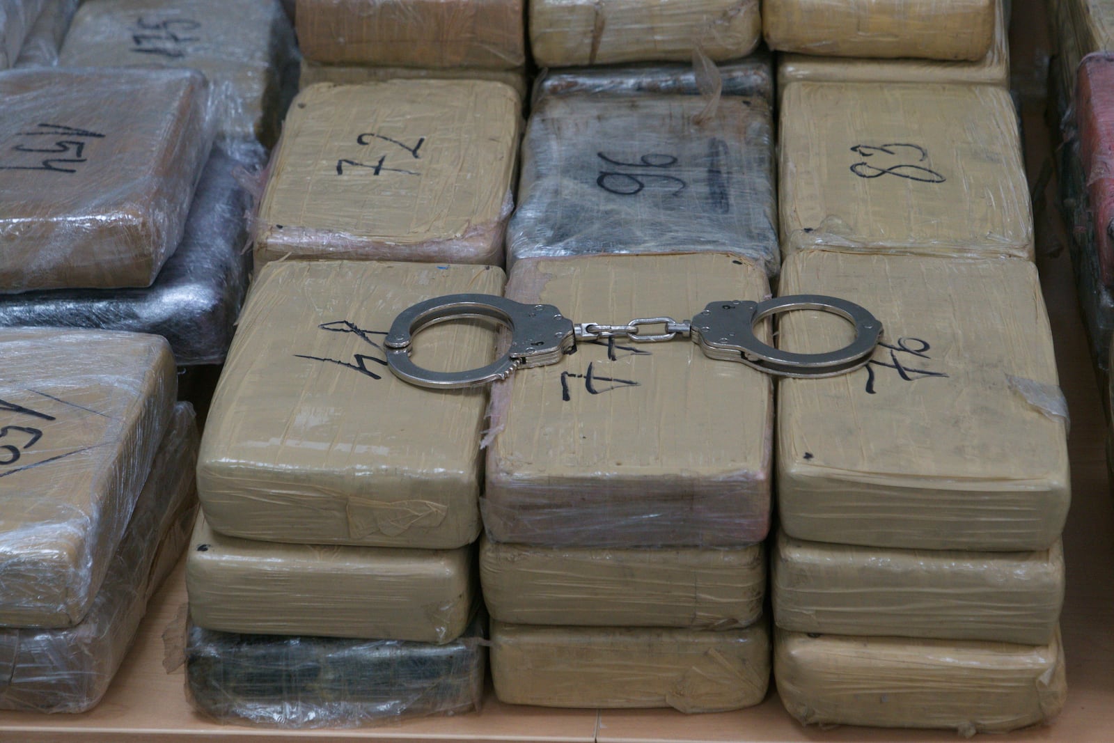 Sealed bags of cocaine which were hidden in suitcases and seized by Bulgarian border authorities, are displayed at a border customs' office in Kapitan Andreevo, Bulgaria, Sunday, July 20, 2025. (Bulgarian Interior Ministry via AP)