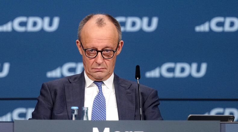 German Chancellor Friedrich Merz, CDU party chairman, attends the CDU federal party conference, in Stuttgart, Germany, Friday Feb. 20, 2026. (Kay Nietfeld/dpa via AP)