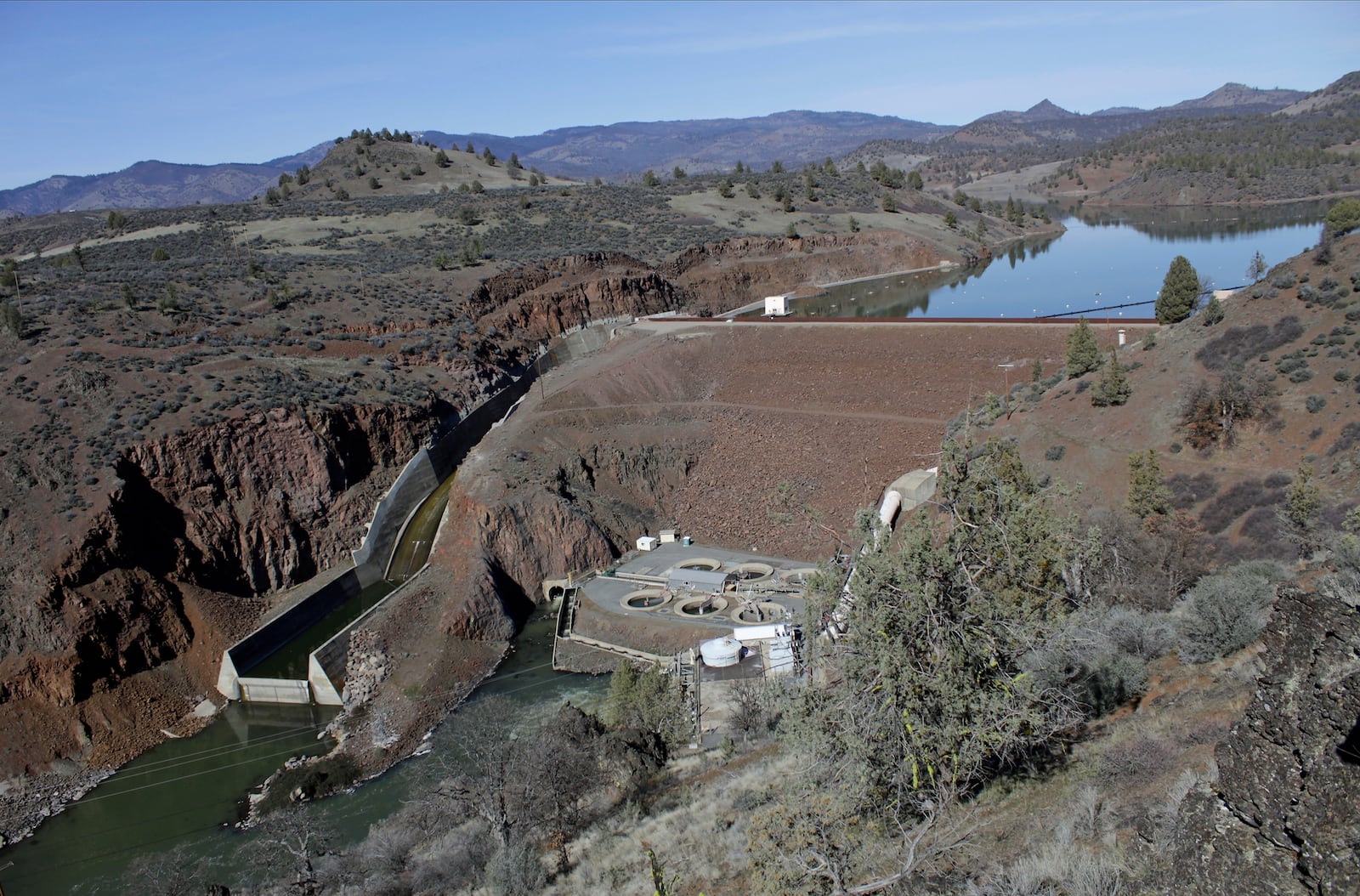 FILE - The Iron Gate Dam powerhouse and spillway are visible on the lower Klamath River near Hornbrook, Calif., on March 2, 2020. (AP Photo/Gillian Flaccus, File)