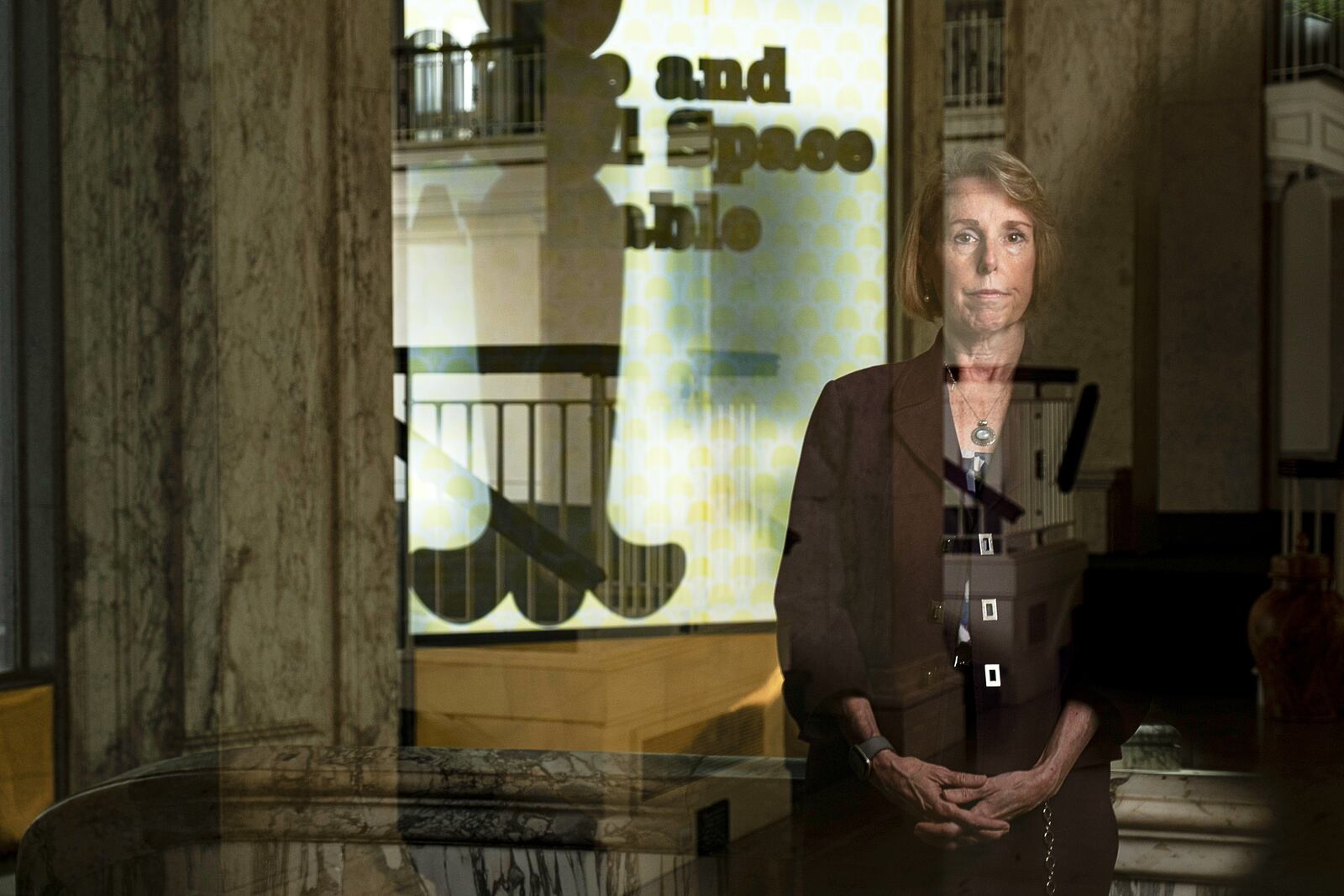 Mary Wearn, president of Georgia Humanities, poses for a portrait in the rotunda of the historic Hurt building where their offices are located in Atlanta, Wednesday, April 9, 2025. (AP Photo/Ben Gray)