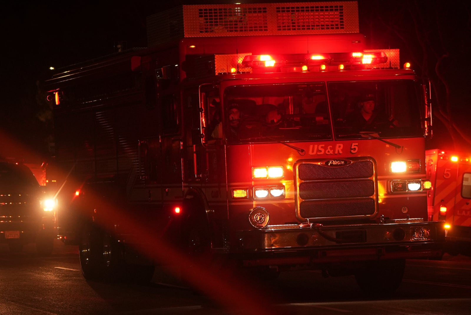A Los Angeles Fire Department truck leaves after a tunnel collapsed on Wednesday, July 9, 2025, in Los Angeles. (AP Photo/Damian Dovarganes)