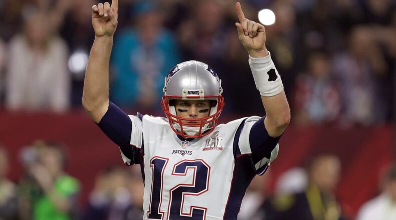 New England Patriots' Tom Brady raises his arms after a touchdown, during the second half of the NFL Super Bowl 51 football game against the Atlanta Falcons, Sunday, Feb. 5, 2017, in Houston. (AP Photo/Darron Cummings)