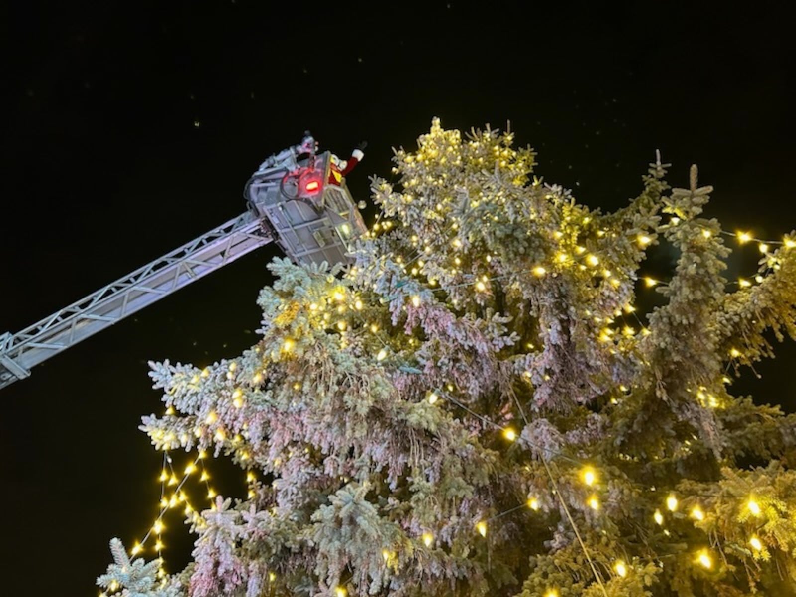 Santa and Mrs. Claus arrived on a fire truck and were elevated to the top of the city tree to light it up and dedicate the opening of the 2025 Holiday in the City festivities on Friday, Nov. 28. BRETT TURNER/CONTRIBUTED PHOTO
