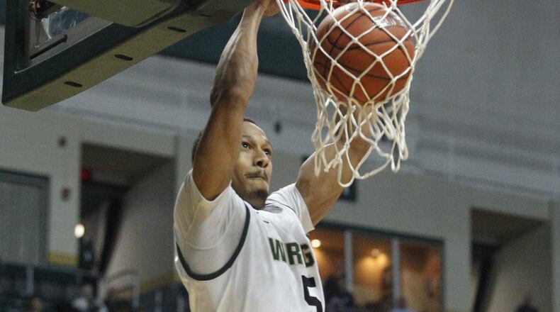 Wright State's Miles Dixon dunks in the first half against Richmond on Monday, March 25, 2013, in the quarterfinals of the CBI tournament at the Nutter Center. David Jablonski/Staff