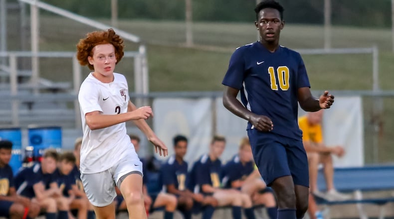 Springfield sophomore Yoro Diallo passes the ball to a teammate during the Wildcats game against Lebanon on Sept. 10 in Springfield. CONTRIBUTED PHOTO BY MICHAEL COOPER